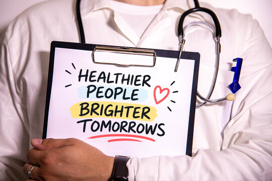 Healthier People Brighter Tomorrows &ndash; Healthcare Awareness and Preventive Medicine Concept with Doctor Holding Inspirational Message