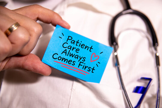 Patient Care Always Comes First  Patient Centered Healthcare Concept with Doctor Holding Blue Card and Stethoscope