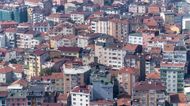 Mass housing in Istanbul, Turkey, packed apartment blocks in a crowded neighborhood of red roofs with almost no green space