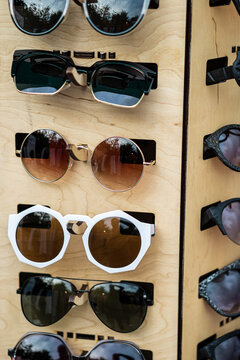 Variety of sunglasses on display stand