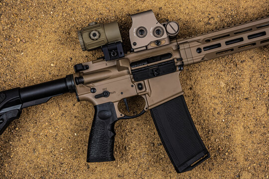 Modern tactical rifle receiver on sand