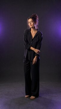 Woman in Relaxed Black Fashion Outfit with Messy Updo