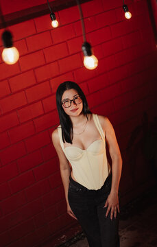 Photoshoot of a beautiful young Latina woman wearing glasses