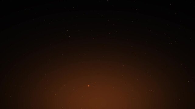 Glowing fire embers and sparks rising on dark warm background loop