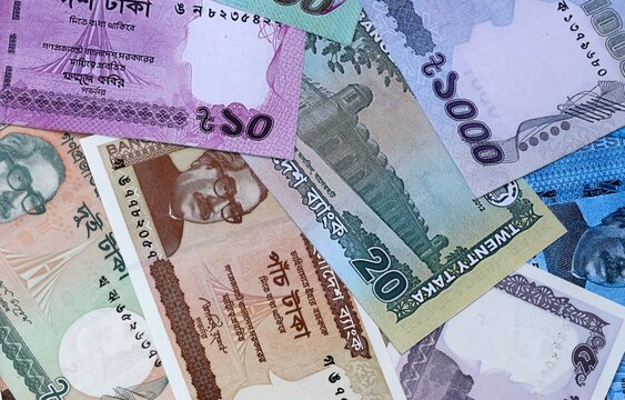 Big amount of Bangladeshi taka money banknotes. Bangladesh cash bills of BDT currency close up