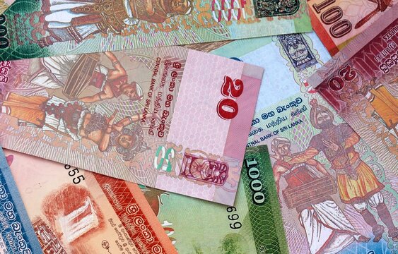Big amount of Sri Lankan rupee money banknotes. Sri Lanka cash bills of LKR currency close up