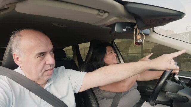 Driving instructor teaching a student driver how to operate a vehicle while sitting together inside a modern car, demonstrating automotive education, safety guidance, and driver license preparation.