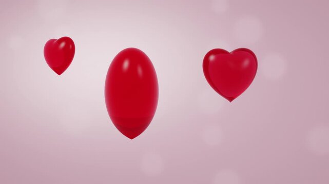 Red glass hearts rotating slowly on a soft pink background