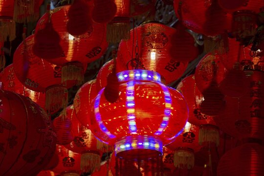 Chinese red hanging lanterns, as offerings, donations and good luck symbols in Wat Mangkon, an important Sino-Thai temple, Chinatown, Bangkok, Thailand