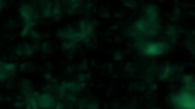 Abstract green smoke and light flickering on black background