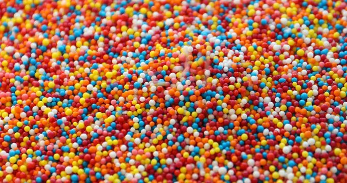 Many bright colorful sprinkles. Decoration for dessert