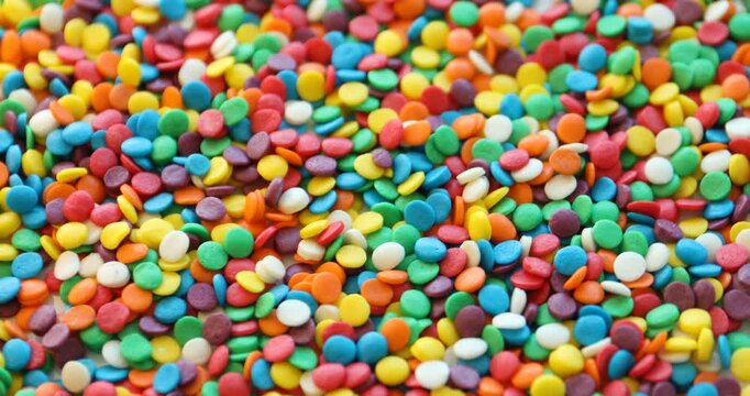 Many bright confetti sprinkles. Decoration for dessert