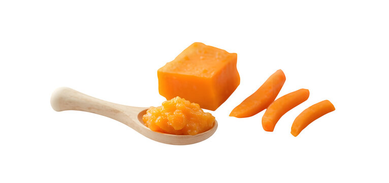 Baby food. Mouth-watering puree blend of carrot and persimmon vibing on a spoon, solo on white background