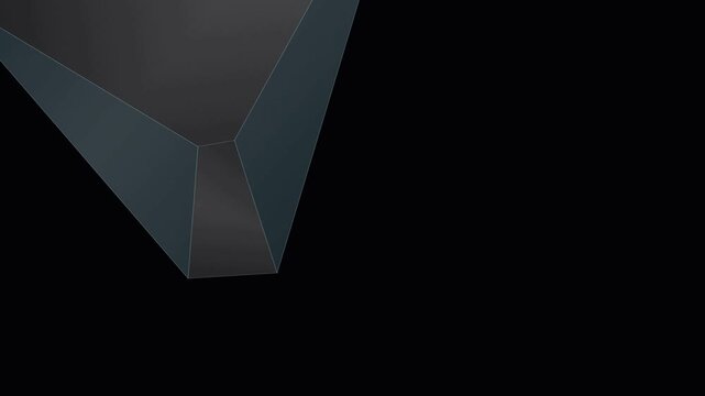 A sharp geometric prism edge casting subtle shadows across darkness displaying dramatic angles and mysterious industrial form giving profound depth to the moody visual atmosphere