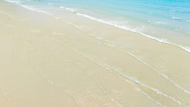 Nature of the ocean and blue sky Summer with sunshine, sandy beaches, clear blue waters sparkling against the blue sky. on an island with good ecology and environment Background for summer vacation