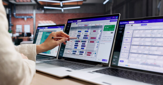 Facility Manager Analyzes Smart Building System Dashboard