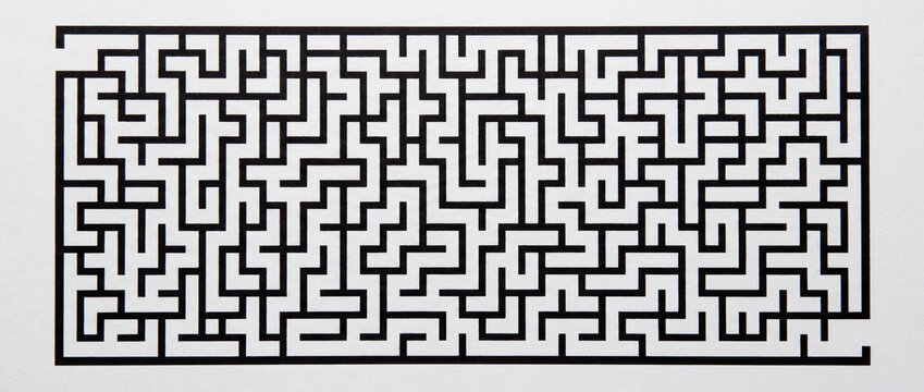 Maze puzzle with black rectangular labyrinth path featuring high contrast geometric lines on white background, ideal for logic games, strategic problem solving, and brain teasers