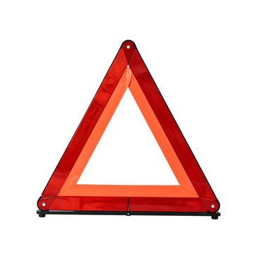 Red reflective emergency warning triangle for vehicle breakdown on white background.