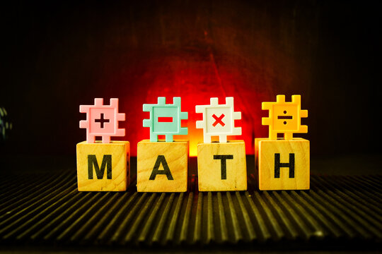 wooden letter blocks spelling MATH and MYTH