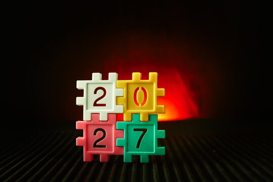colorful puzzle blocks forming the number 2027