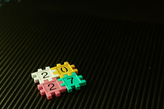 colorful puzzle blocks forming the number 2027