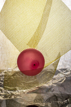 Yellow mesh with a red balloon