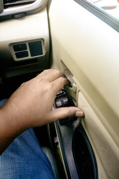 pulling the inner door handle to open a car