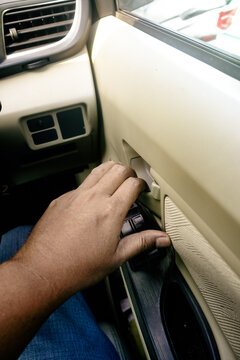 pulling the inner door handle to open a car