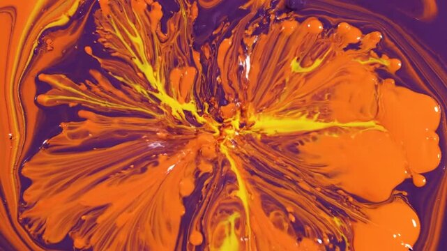Abstract swirl of purple and orange liquid paint