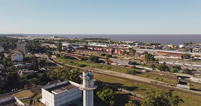 Buenos Aires Argentina Aerial v85 high angle wide tracking flyover above Retiro rail yards toward Aeroparque Jorge Newbery and Palermo parks - Shot with 5k Camera - Jan 5th 2026
