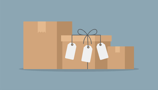 Three different sized brown cardboard delivery boxes with one in the center featuring tied string and three blank price tags.