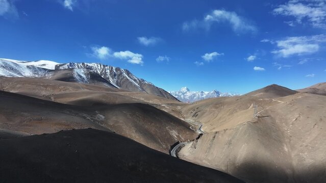 panlong ancient road winding through desert valley in xinjiang