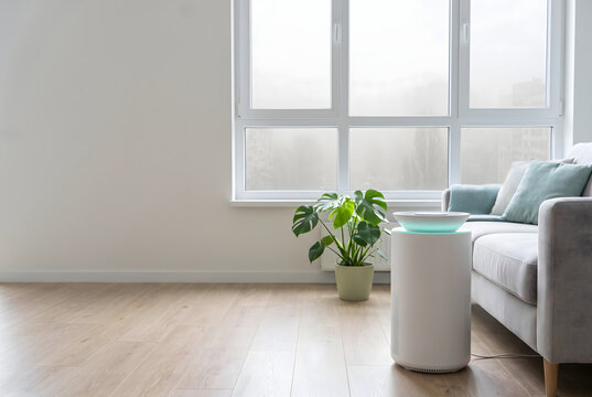 Air purifier running in bright living room with haze outside