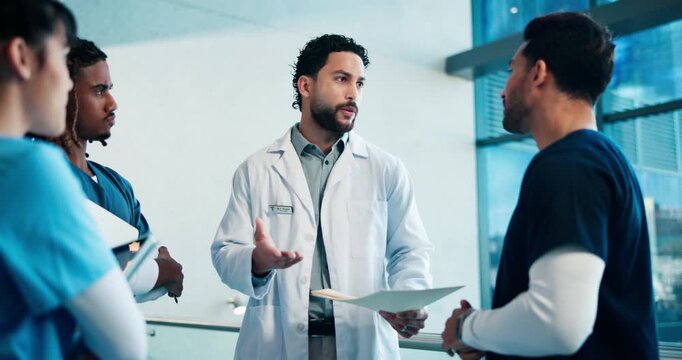 Doctor, talking and team in hospital with folder, mri report and donor registry for treatment. People, surgeon and chat in lobby with document, organ donation and collaboration for medical transplant