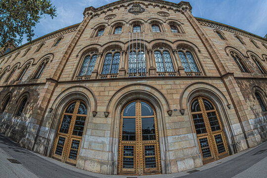 Historic Building of the University of Barcelona at Pla&ccedil;a Universitat, showcasing Neo-Romanesque and Neo-Gothic architecture designed by Elies Rogent in 19th-century Spain.