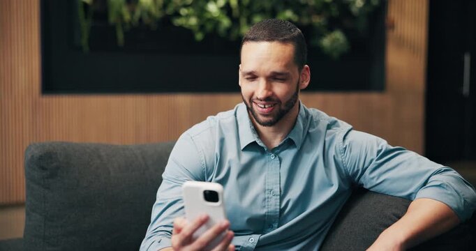Business, man or phone in airport lounge for video call, flight info or layover update for work trip. Transit lobby, happy person or virtual chat with host client, confirm arrival or corporate travel