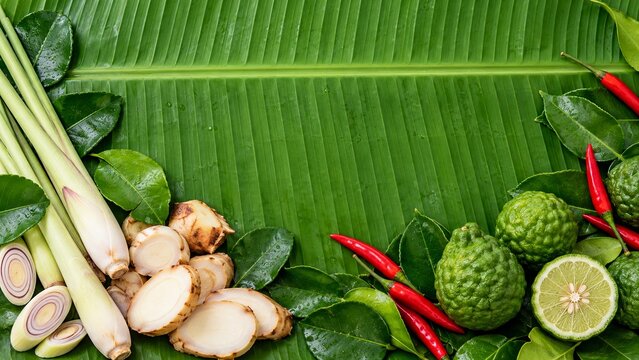 Thai herbs and spices on fresh banana leaf