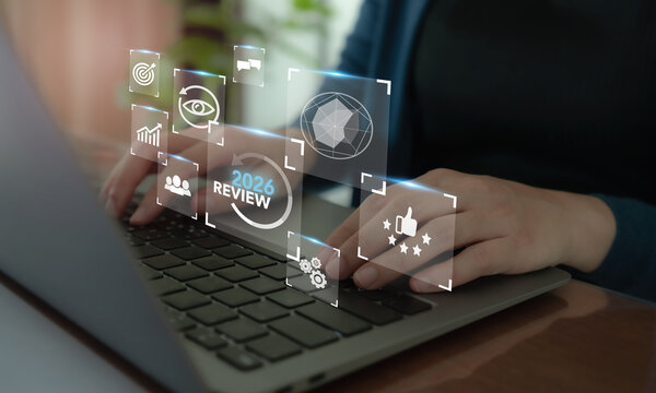 2026 Year in Review. Digital Business Performance Analysis, Annual Evaluation and Strategic Planning. Using a laptop with virtual 2026 review dashboard, performance charts, target icons and analytics.