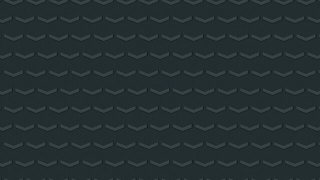 Staggered chevron tread blocks in a dark rubber surface