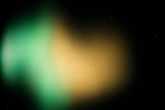 Dark Vintage Emerald Green and Golden Amber Light Leak Overlay with Fine Film Grain Texture Background for Vintage Photo Editing