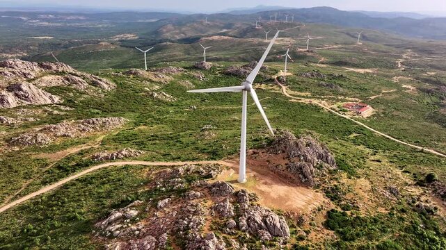 Aerial view of wind turbines on mountain landscape in Sardinia, Italy