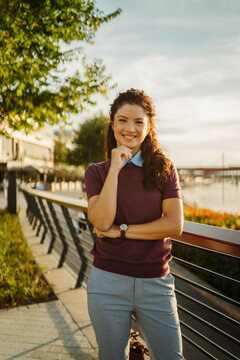 Confident businesswoman smiling outdoors in urban setting