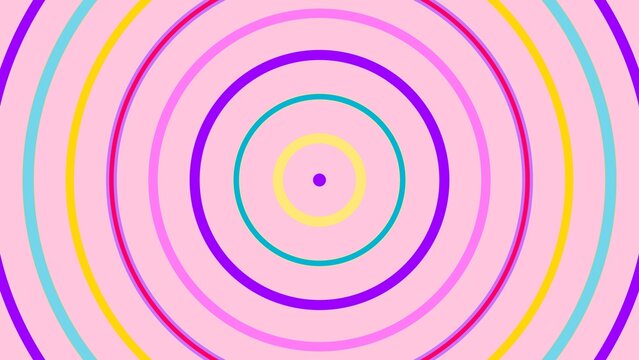 Vibrant concentric rings in multiple colors radiate outward from a tiny central dot against a soft pink background.