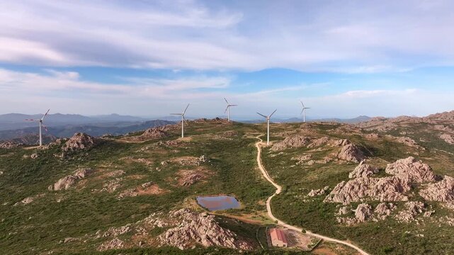 Aerial view of wind turbines on mountain landscape in Sardinia, Italy