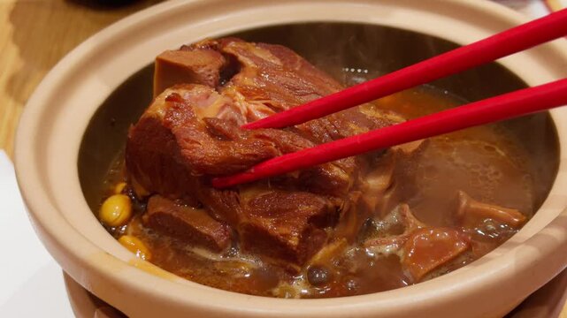 Chopsticks Lifting Northeast Chinese Braised Pork Bone Meat Close-Up Dongbei