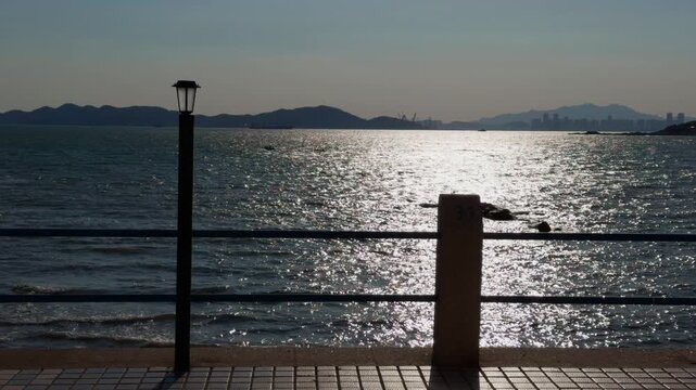 Qingdao Seaside Fence Street Lamp Backlit Ocean View Dusk Cinematic