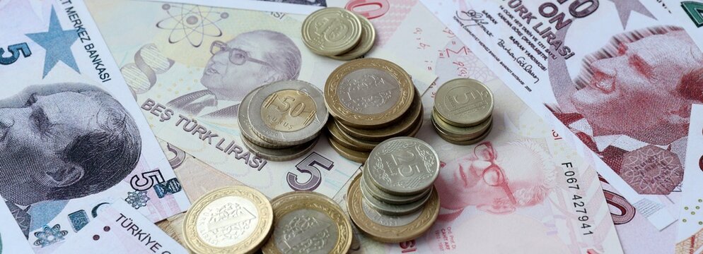 Turkish lira money banknotes and coins on table. Turkey cash bills of TRY currency