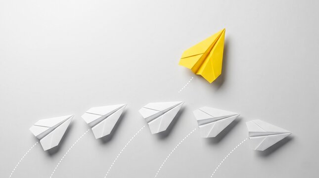 Business leadership concept with yellow paper airplane leading white