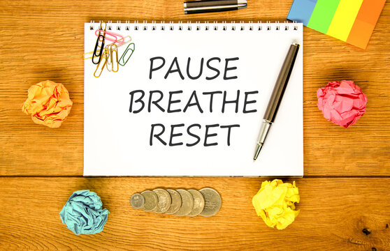 Pause breathe reset words symbol. Concept words Pause breathe reset on beautiful white note. Beautiful wooden background. Business support motivational and pause breathe reset concept. Copy space.