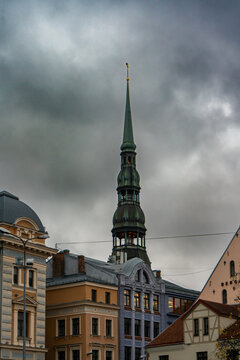 The distinctive green copper spire and clock tower of St. Peter's Church in Riga Latvia